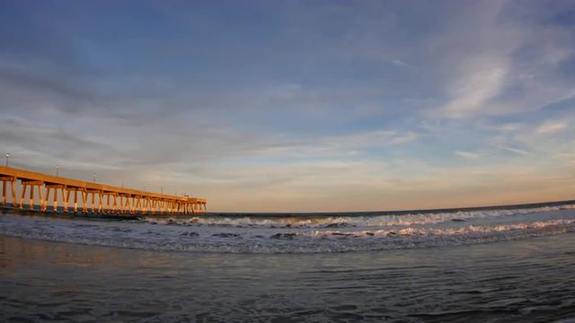 View of a Lifeguard Tower at the beach with Seagulls Flying Passed It