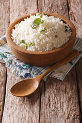 Paleo Food: Cauliflower rice with herbs close-up. Vertical
