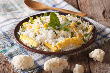 Dietary food: cauliflower rice with scrambled eggs. horizontal
