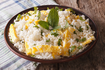 Cauliflower rice with egg and mint for paleo close-up. horizontal
