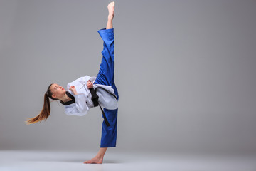 The karate girl with black belt 