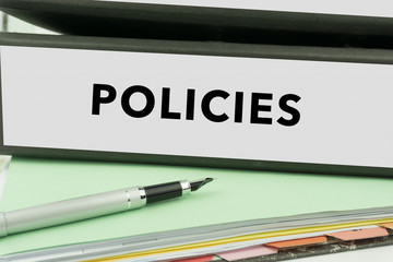 Policies - Ring Binder in the office. Business Concept