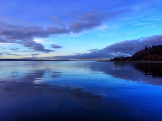 symmetrical reflection of sky on water