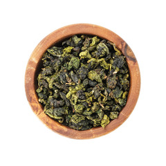 oolong green tea heap in bowl, isolated on white