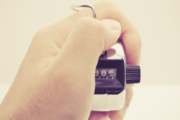 hand hold tally counter and click for count number