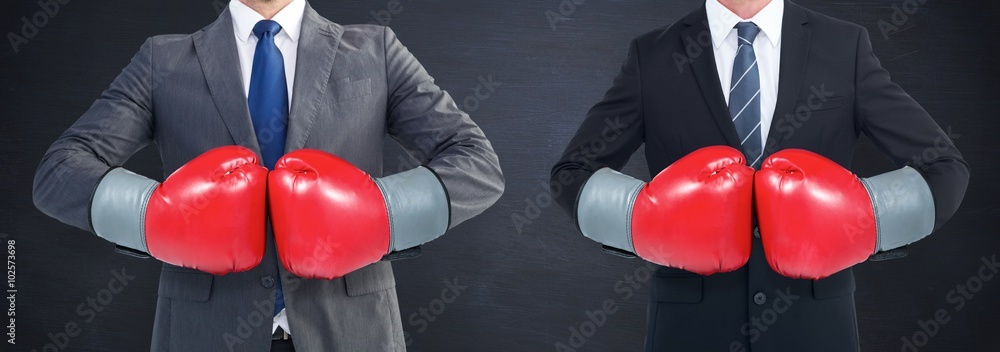 Canvas Prints Composite image of businessman with boxing gloves