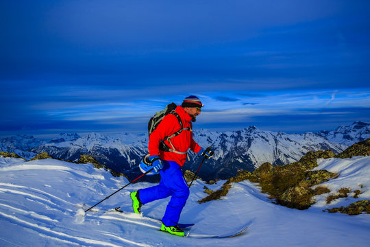 Ski tour - skier climbing to the top
