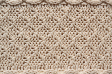 Beige white knitted sweater texture background. Space for copy, text, lettering.