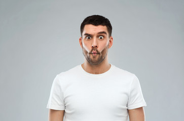man with fish-face over gray background