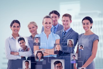 Composite image of business team smiling at camera