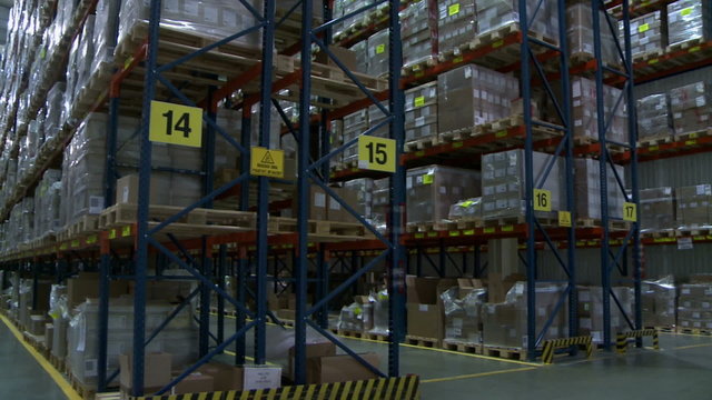 Warehouse. View of racks with pallets and boxes