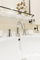 Bathroom interior with white sink and faucet