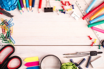 Office supplies on wooden background