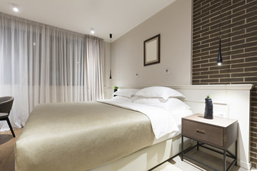 Fototapeta na wymiar Master bed hotel bedroom in the evening