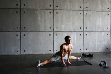 Man on the Mat practicing yoga and fitness