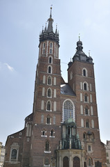 Fototapeta na wymiar St. Mary's Church built in brick gothic style in the Main Market Square in Kraków, Poland
