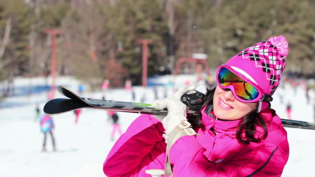 Woman carries skis on the shoulder, Video clip