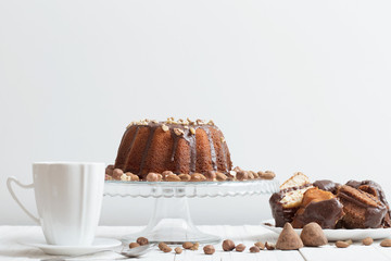cup of coffee and cake on wooden table