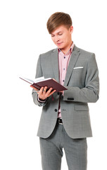 Young businessman in suit with notepad