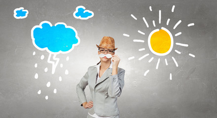 Businesswoman trying paper mustache