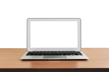 Fototapeta premium laptop with blank screen on wooden table, isolated on white background