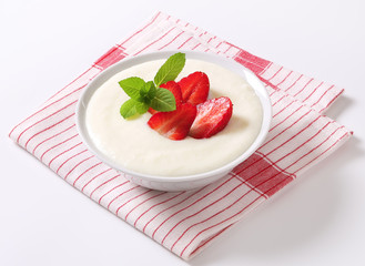 Milk pudding with strawberries