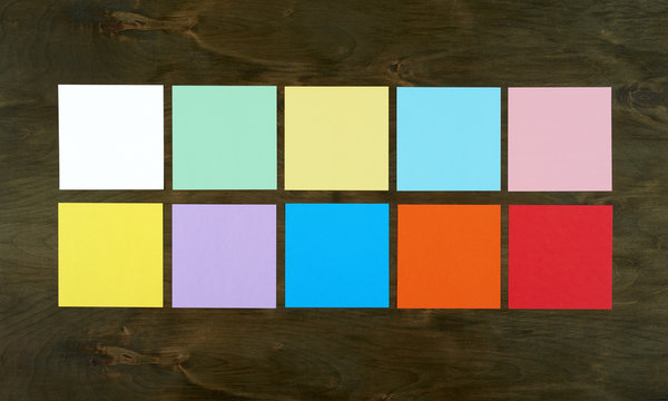 Flat lay color bar from paper on wood background. Flat design and top view of interface concept on desk.
