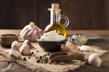 Aioli dip on wooden background