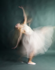 Naklejka premium Ballet dancer woman in motion blur, ballerina