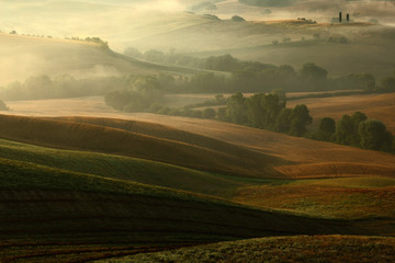 Idyllic view of hilly farmland in Tuscany in beautiful morning light, Italy