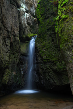 Waterfall Maly Adrspassky vodopad in the rock mountain Adrspasske skaly, Czech republin