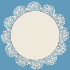 Light beige round lacy frame on blue background
