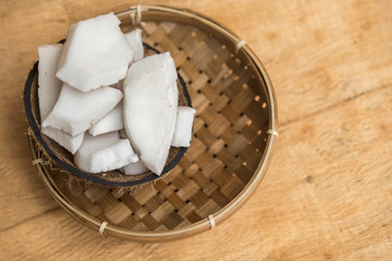 Old coconut pulp in rattan bowl