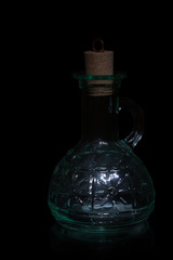 Bottle with handle on a black background