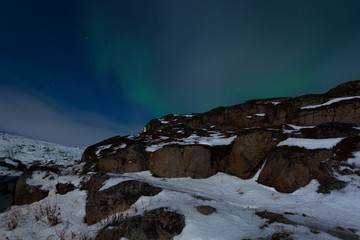Beautiful green aurora on a blue night sky