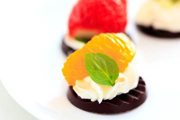 fruits on the chocolate with whipped cream