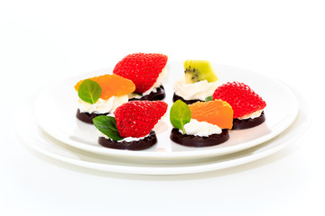 fruits on the chocolate with whipped cream