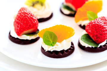 fruits on the chocolate with whipped cream