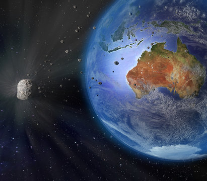 An illustration of a large asteroid flying closely by Earth. Earth land and clouds texture maps courtesy of NASA.gov.