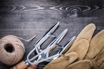 Trowel fork rake protective gloves hank of rope gardening concep