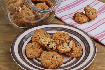 Oatmeal cookies on plate and glass jar