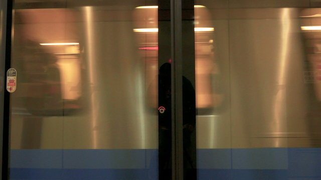 TAIPEI,  TAIWAN - FEBRUARY 9, 2016: Taipei MRT coach full of passengers about to stop at Dongmen MRT Station