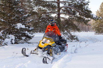 Athlete on a snowmobile.