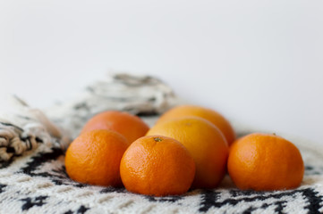 Mandarines on white blanket