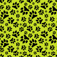 Seamless pattern black dog footprint with claws isolated on green background.