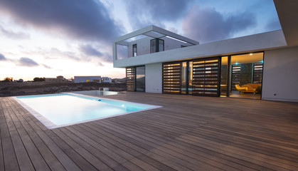 Naklejka na ściany i meble Luxury modern home with backyard swimming pool