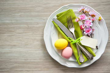 Easter table setting with spring flowers and cutlery
