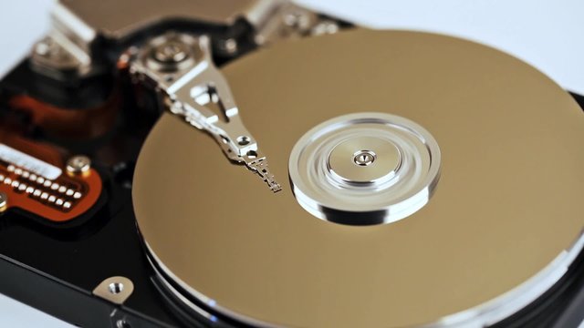 hdd data recovery - coseup of computer hard disc spinning
