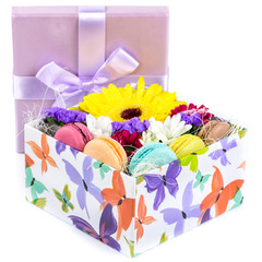 Closeup of  Flowers and macaroon in a box. Shallow depth of fiel