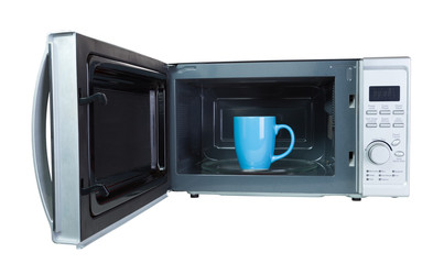 Microwave oven with a blue cup.